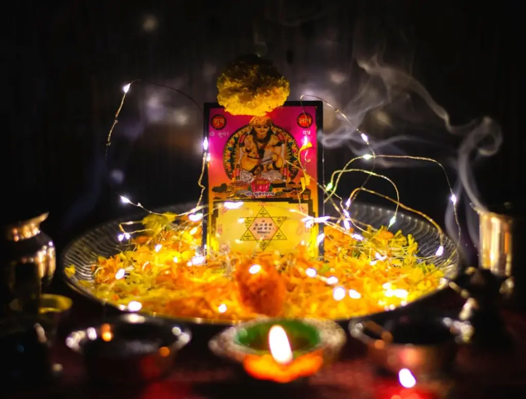 Families preparing Lakshmi-Ganesh Puja during Diwali evening celebrations in Delhi.