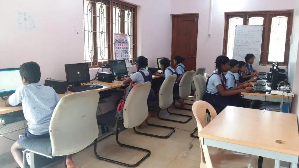 Vocational instructors teaching practical equipment handling and classroom technical skills safely.